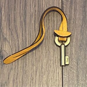 Vintage Fossil brand yellow leather purse charm